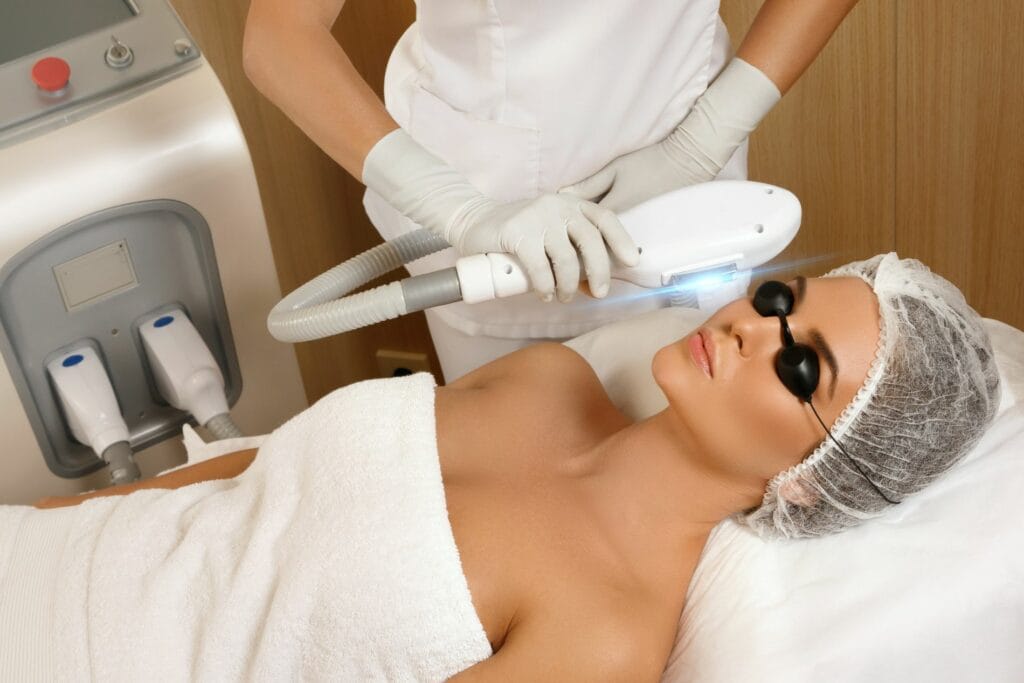 Adult woman during rf-lifting face skin tightening with her beautician at a beauty salon, close-up | Lily Med Spa in Dallas, Texas